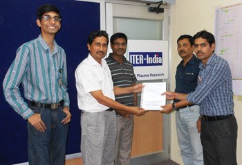 ITER-India head Shishir Deshpande (in white) handing over the MoU to the Port Plug Project team on 22 July 2013. With Shishir, from right to left, Siddharth Kumar (Technical Responsible Officer), Vinay Kumar (Project Manager, Diagnostics), Shrishail Padasalagi (Head, Design Office & Member Diagnostics) and Dilshad Sulaiman (Project Office Responsible Officer). (Click to view larger version...)